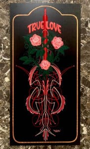True Love with 3 red flowers and pinstripes on black panel