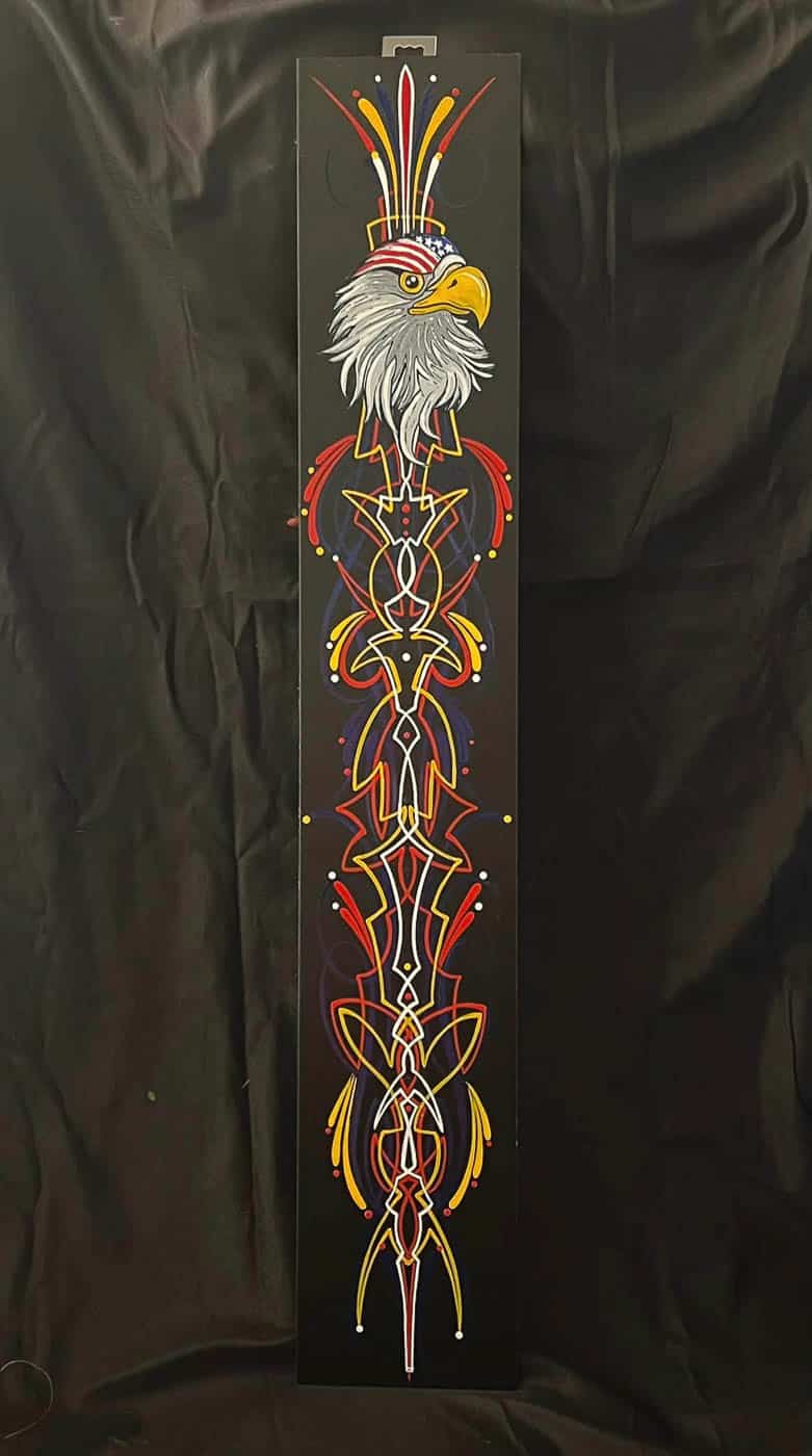 Eagle head and pinstripes on black panel
