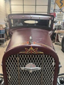 Pinstripes on grill shell and hood of 1931 Plymouth coupe